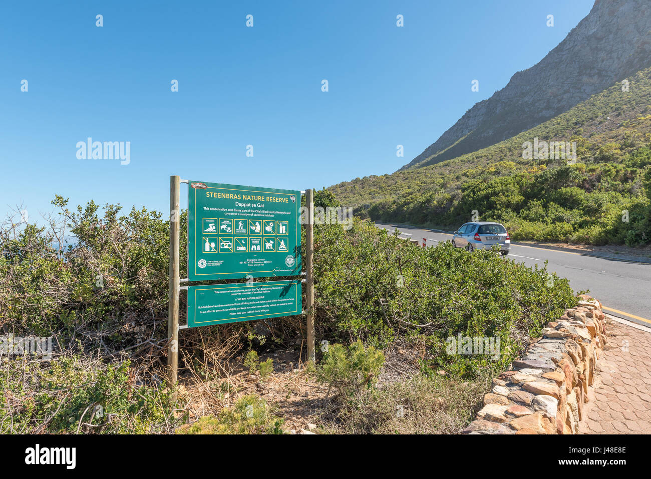 CLARENCE DRIVE, SOUTH AFRICA - MARCH 29, 2017: An information board at Dappat se Gat next to Clarence Drive between Gordons Bay and Rooi-Els Stock Photo