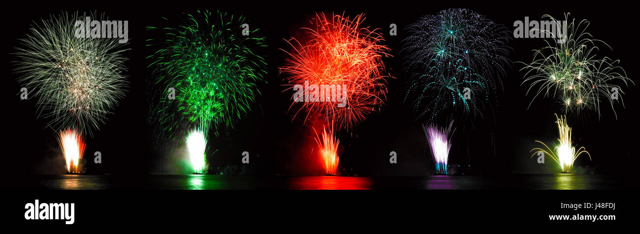 White fireworks, green firework, red wirework, blue firework. Stock Photo
