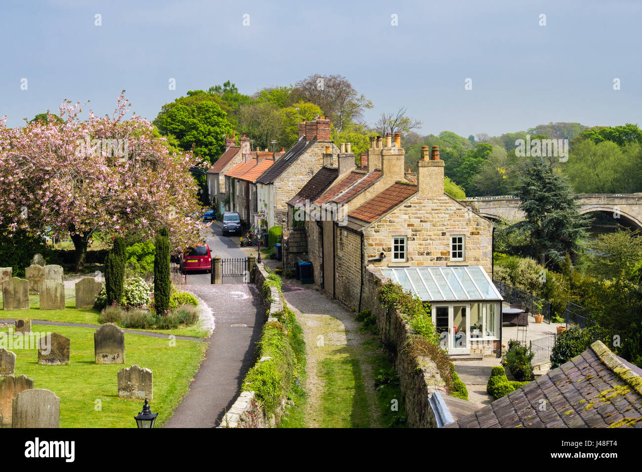 Yorkshire stone cottages in historic country village beside River Ure seen from Marmion Tower. West Tanfield, North Yorkshire, England, UK, Britain Stock Photo