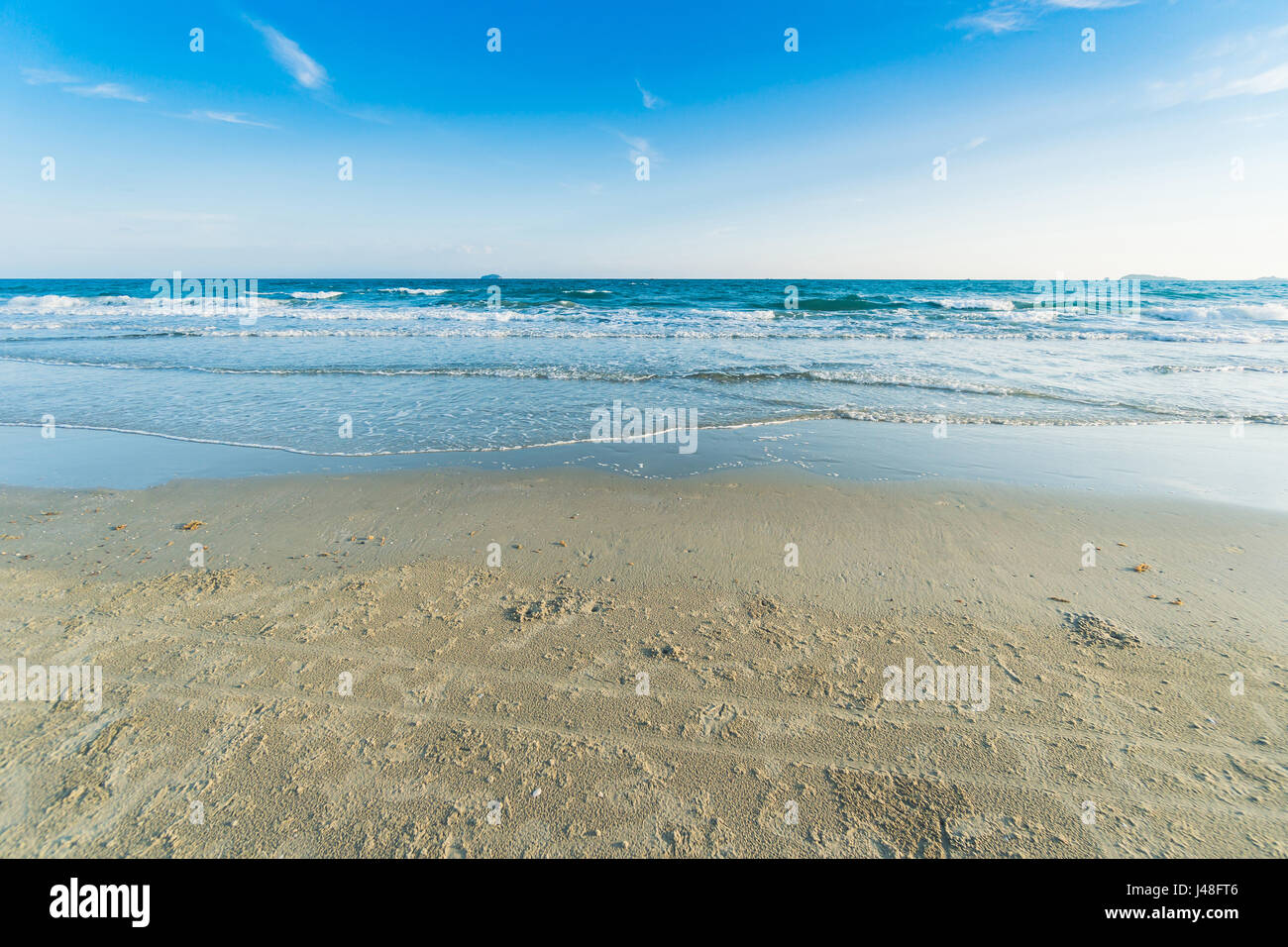 Tropical beach with clear water and blue sky Stock Photo - Alamy