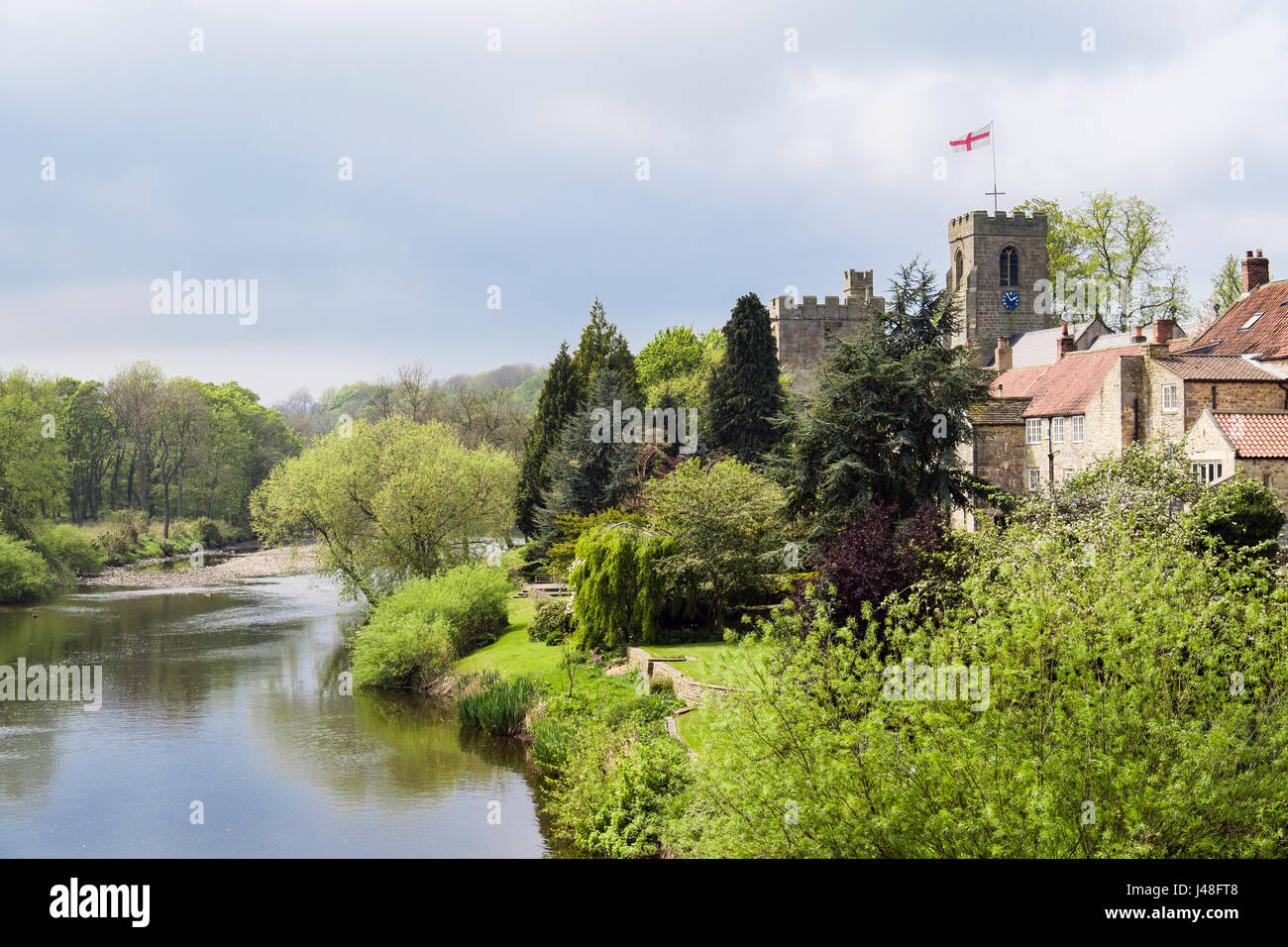 Yorkshire country village church and Marmion Tower beside River Ure. West Tanfield, North Yorkshire, England, UK, Britain Stock Photo
