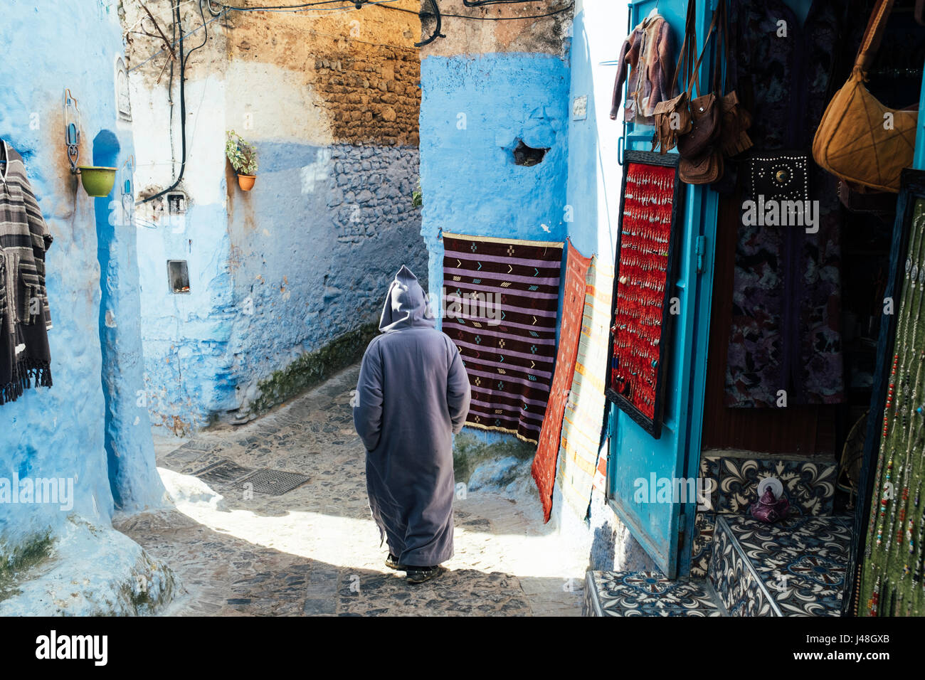 Man exploring bright blue coloured Chefchaouen old town, Morocco, africa Stock Photo