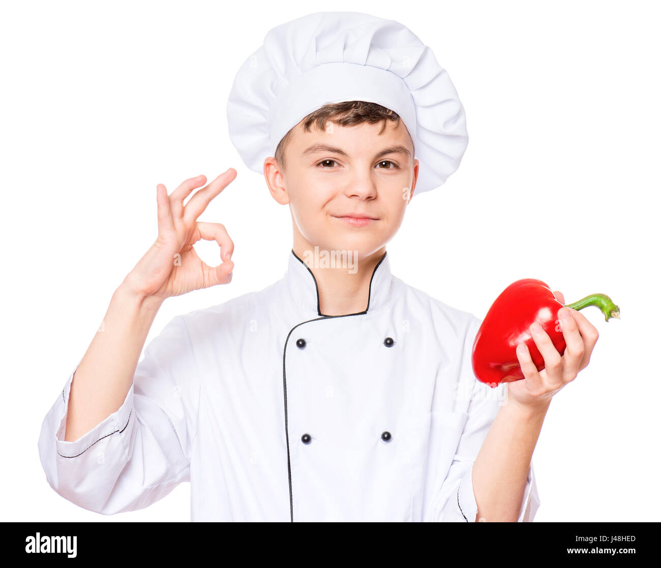 Teen boy wearing chef uniform Stock Photo Alamy