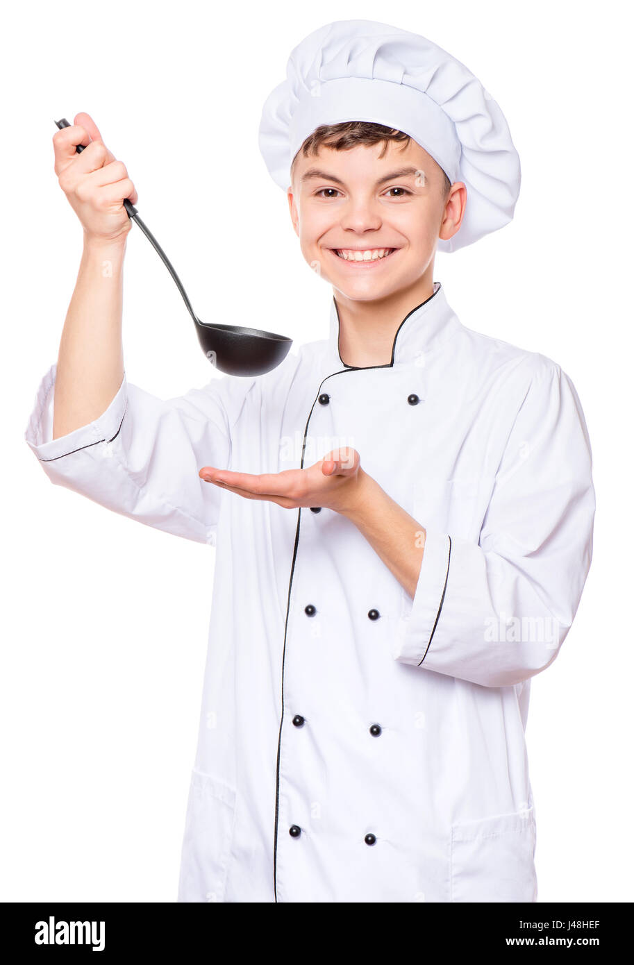 Teen boy wearing chef uniform Stock Photo Alamy