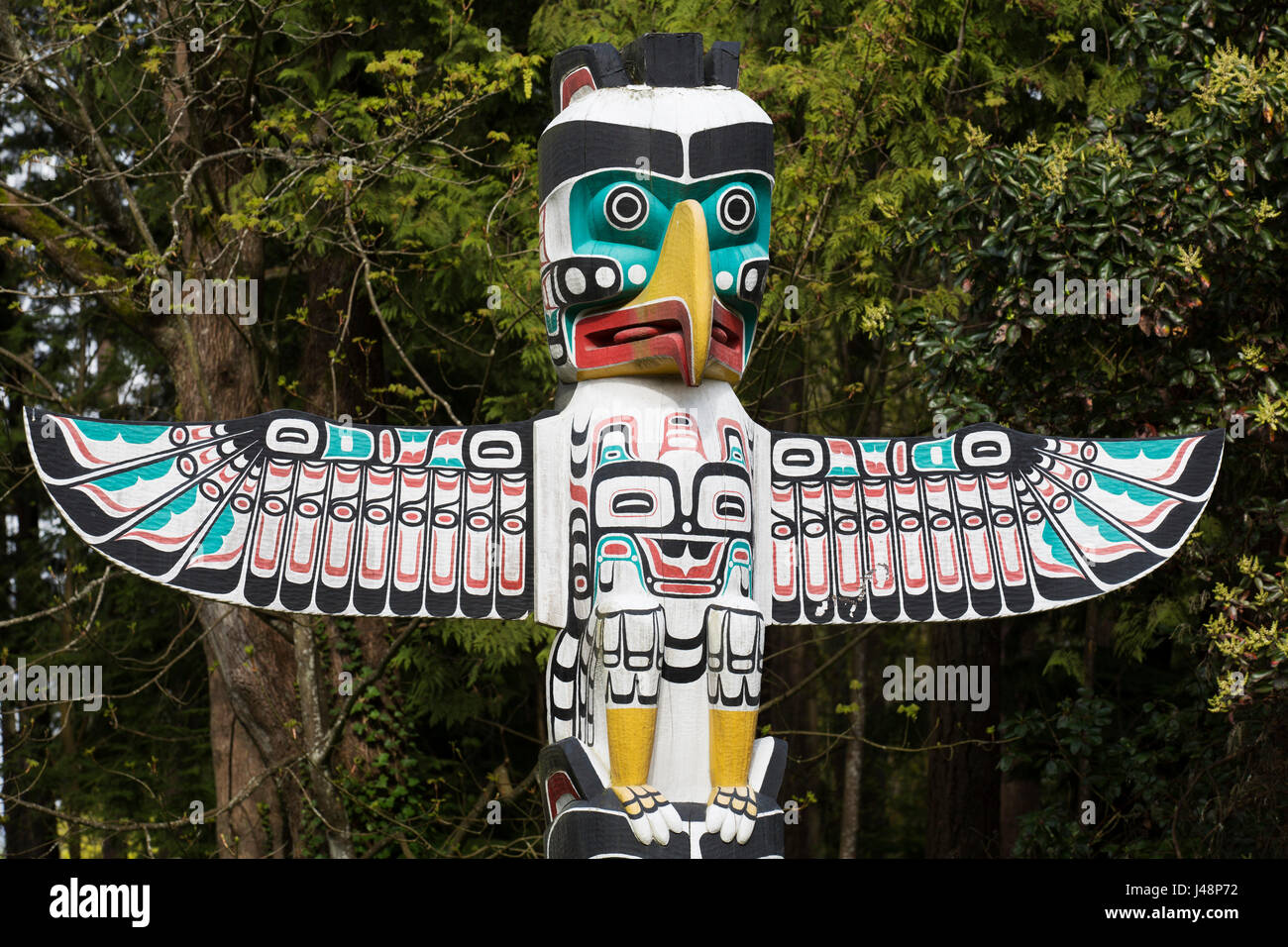 Thunderbird house post at Brockton Point in Stanley Park in Vancouver, Canada. Nine totem poles stand in the park and are British Columbia's most popu Stock Photo