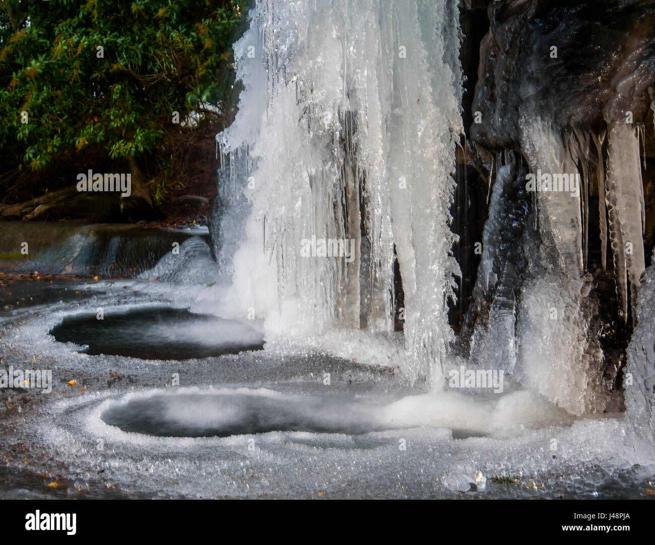 An artificial waterfall freezes at a hotel; Portland, Oregon, United States of America Stock Photo