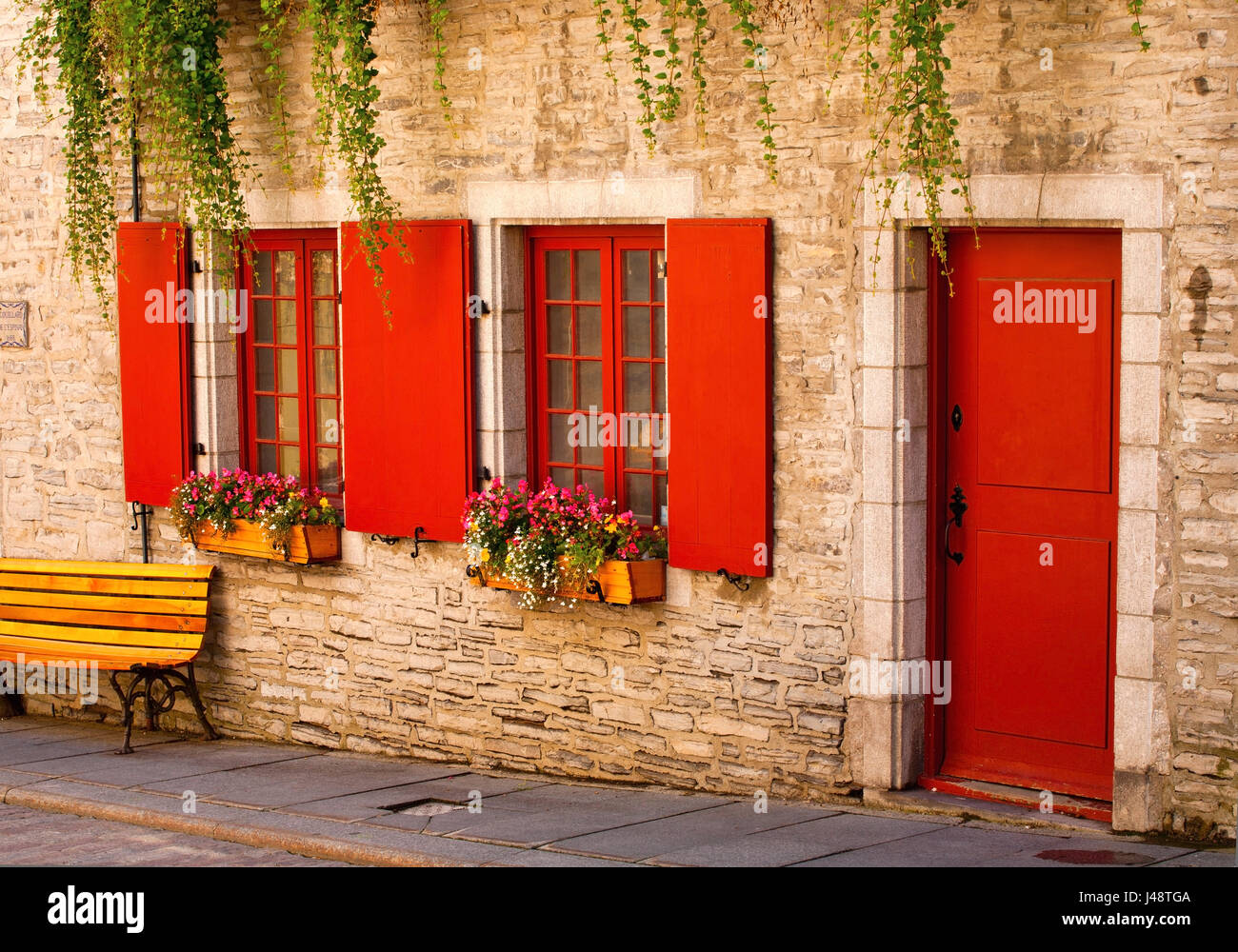 Red Doors And Window Shutters On A Building In The Lower Village Of Old