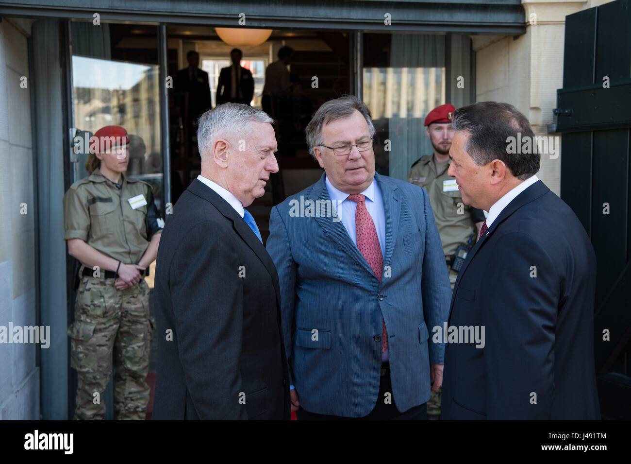 U.S. Secretary of Defense Jim Mattis, left, and Danish Minister of Defence Claus Hjort Frederiksen welcome Turkish Deputy Undersecretary of Defence Basat Öztürk for the Global Coalition on the Defeat of ISIS meeting at Eigtveds Pakhus May 9, 2017 in Copenhagen, Denmark. The meeting comes on the heals of President Donald Trump announcing that the U.S. will arm Kurdish rebels fighting in Syria. Stock Photo