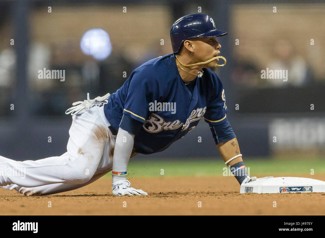 The Tag. 9th May, 2017. Milwaukee Brewers shortstop Orlando Arcia #3 dives back to second base and waits the call from the field umpire during the Major League Baseball game between the Milwaukee Brewers and the Boston Red Sox at Miller Park in Milwaukee, WI. Arcia was called out on the tag. John Fisher/CSM/Alamy Live News Stock Photo