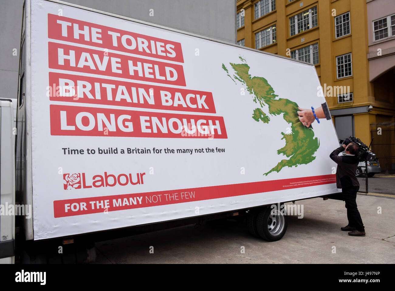 London, UK.  11 May 2017.  A TV cameraman at work at the unveiling of a new campaign poster for Labour’s General Election campaign at a press call on the South Bank.   Credit: Stephen Chung / Alamy Live News Stock Photo