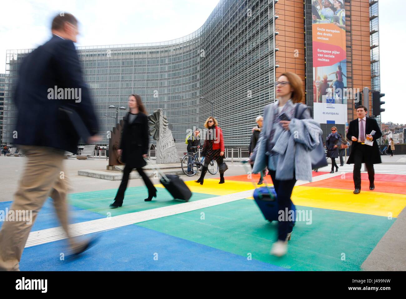 Brussels, Belgium. 11th May, 2017. People walk on pedestrian crossing in the colours of the rainbow flag in front of European Commision building in Brussels, Belgium, May 11, 2017. Credit: Ye Pingfan/Xinhua/Alamy Live News Stock Photo
