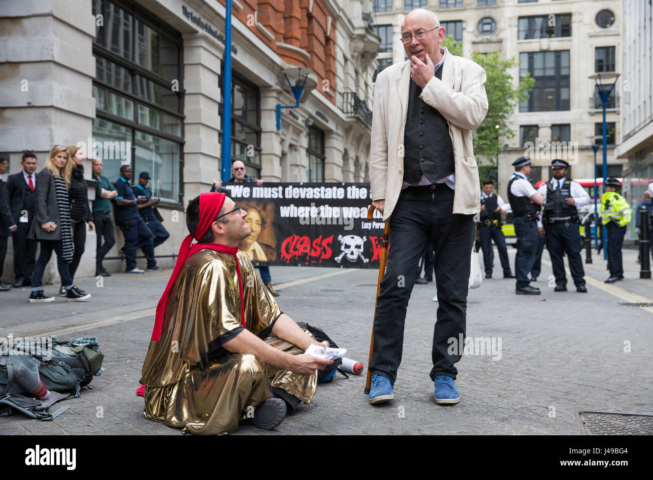 London, UK. 11th May, 2017. Ian Bone (r) of Class War talks to a Life Not Money activist during a protest in solidarity with cleaners at the London School of Economics (LSE) belonging to the United Voices of the World trade union recommencing indefinite one-day-a-week strike action for parity of terms and conditions of employment with in-house staff after no offer was made to them by the LSE following the calling-off of their previous strike action. Credit: Mark Kerrison/Alamy Live News Stock Photo