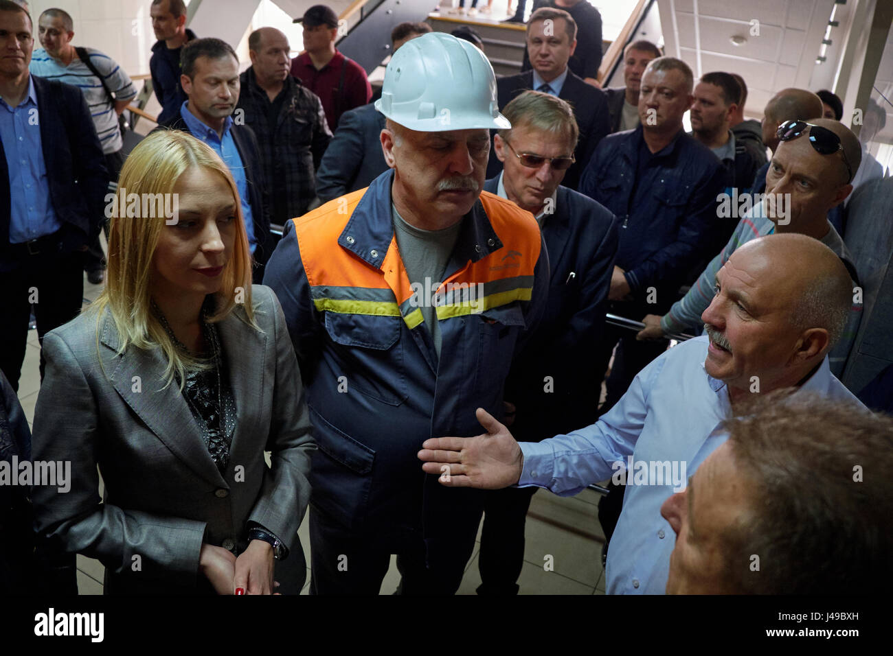 Kryvyi Rih, Ukraine. 11th May, 2017. Sergii Ivanchenko inside the factory management building talks to Chief Marketing Officer of of РJSC ArcelorMittal Kryvyi Rih Anastasiya Tatarulieva and Chief of Steelmaking Department Olexander Zozulia during the meeting with main claim to Chief Executive Officer (CEO) Paramjit Kahlon to increase a minimum monthly salary up to equivalent of 1000 EURO. They demanded to improve social conditions and workplace safety too. Credit: Dmytro Aliokhin/Alamy Live News Stock Photo