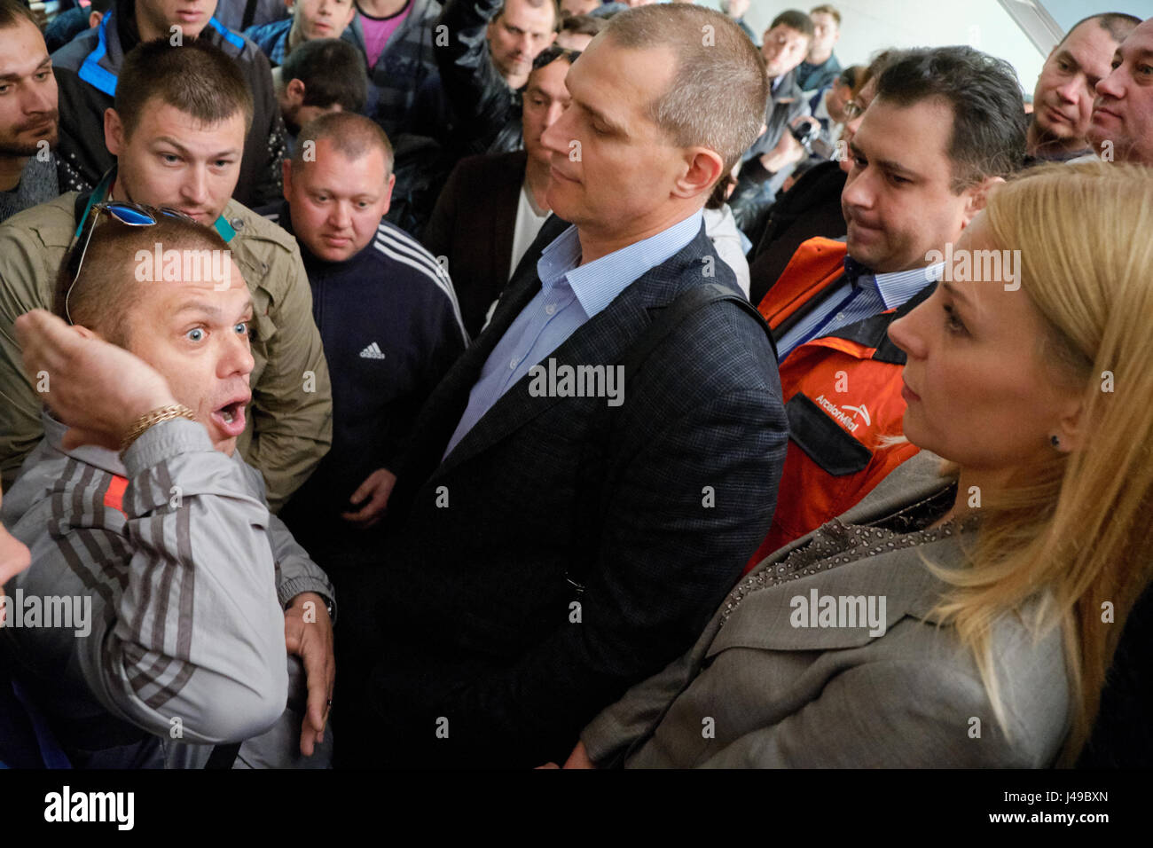 Kryvyi Rih, Ukraine. 11th May, 2017. Protester inside the factory management building emotionaly talks to Chief Marketing Officer of of РJSC ArcelorMittal Kryvyi Rih Anastasiya Tatarulieva during the meeting with main claim to Chief Executive Officer (CEO) Paramjit Kahlon to increase a minimum monthly salary up to equivalent of 1000 EURO. They demanded to improve social conditions and workplace safety too. Credit: Dmytro Aliokhin/Alamy Live News Stock Photo