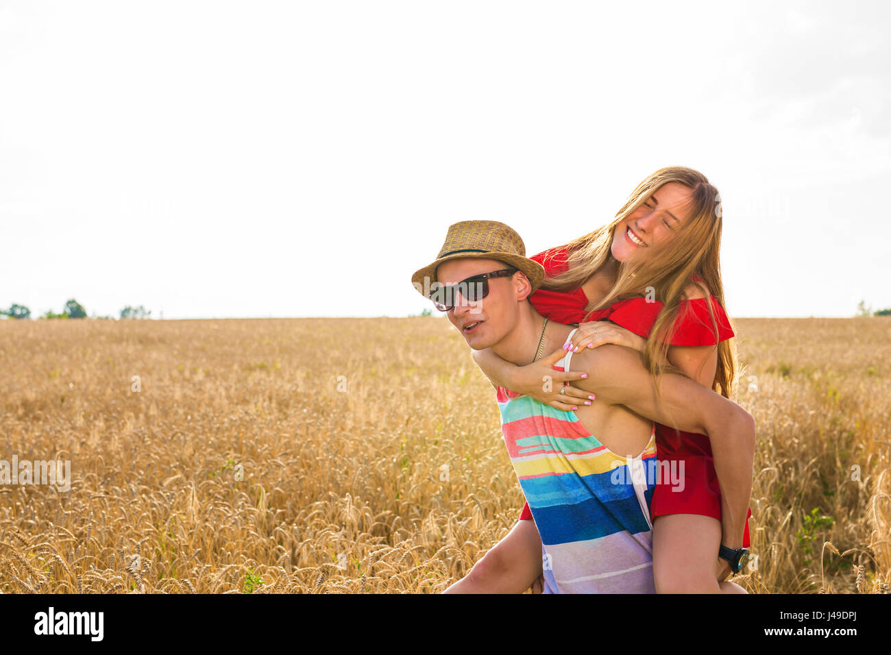 Happy Couple Having Fun Outdoors on wheat field. Freedom Concept ...