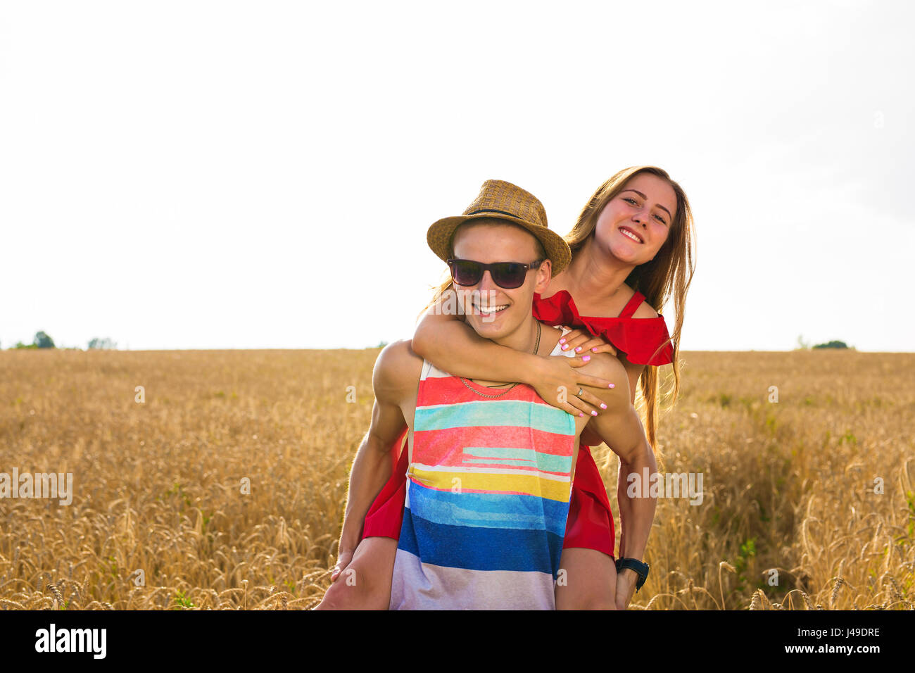 Happy Couple Having Fun Outdoors on wheat field. Freedom Concept ...