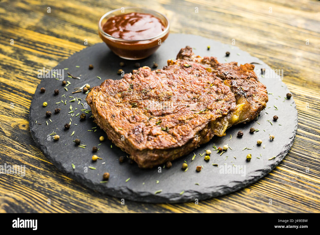 Grilled beef steak with sauce Stock Photo - Alamy