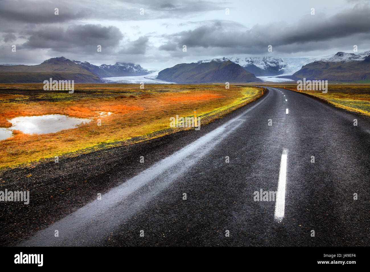 Scenic view of highway and glaciers in the south of Iceland Stock Photo