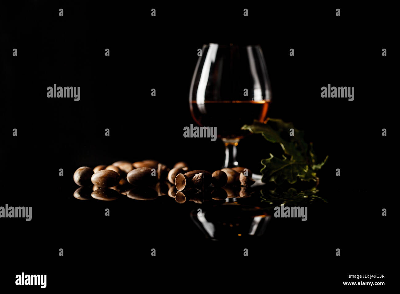 sherry glasses over a dark background with plenty of copy space and oak