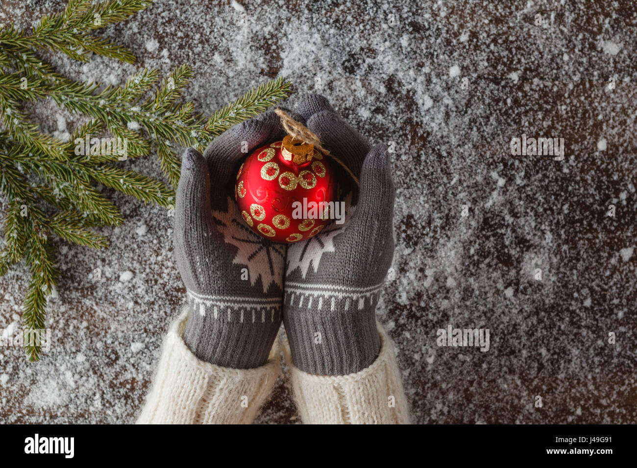 Girl hold christmas ball in hands Stock Photo