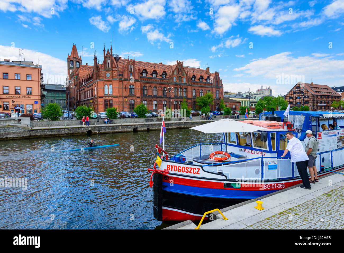 Bydgoszcz, Poland - May 8, 2016; Old Town and tourist boat - cruise ship on Brda River Stock Photo