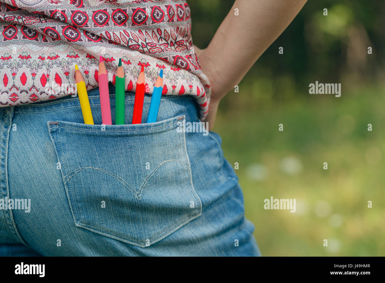 Denim pocket with colored pencils Stock Photo Alamy