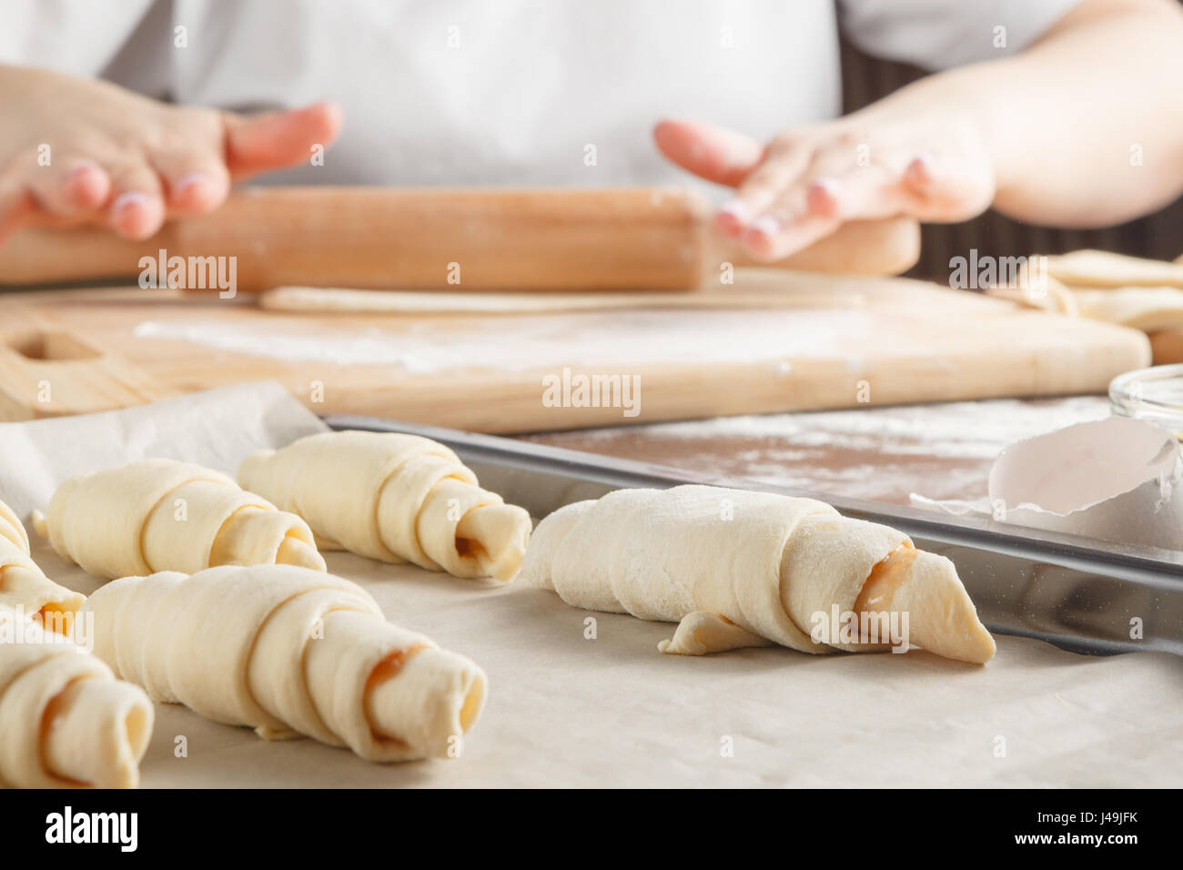 Making Croissant Cookies with Jam. Roll up Stock Photo Alamy