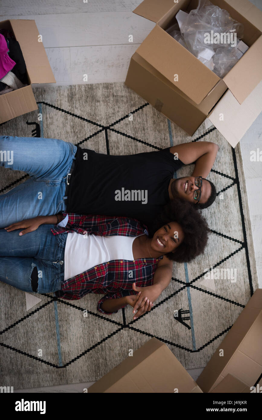 Top view of attractive young African American couple moving, holding ...