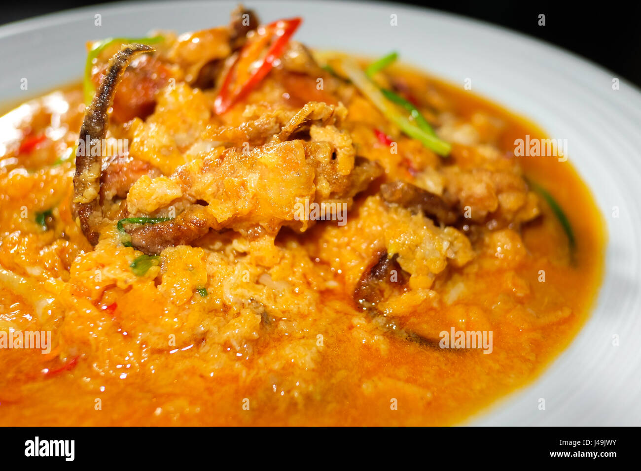 Seafood with Yellow curry sauce, sauteed seafood contains fish, shrimp