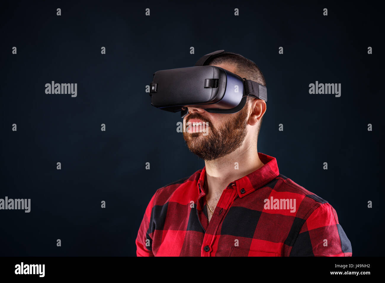 Young bearded man wearing virtual reality glasses Stock Photo - Alamy