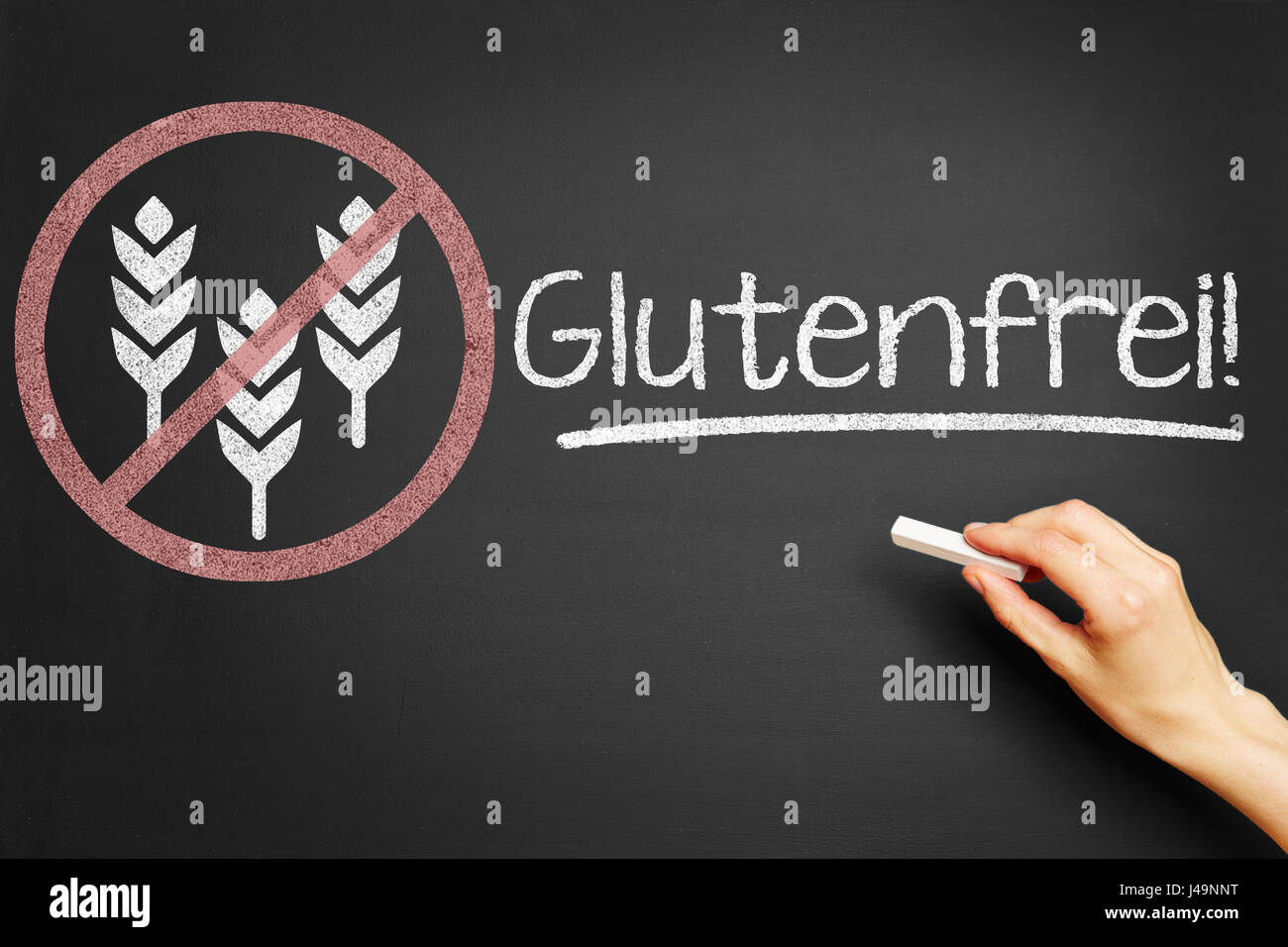 German word 'Glutenfrei' (gluten free) as symbol with wheat in forbiden sign drawn with chalk on blackboard Stock Photo