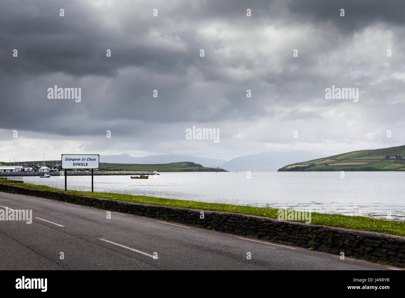 Dingle, County Kerry, Ireland - The entrance of the town of Dingle (Daingean ui Chuis,) on a dark and cloudy day. Stock Photo