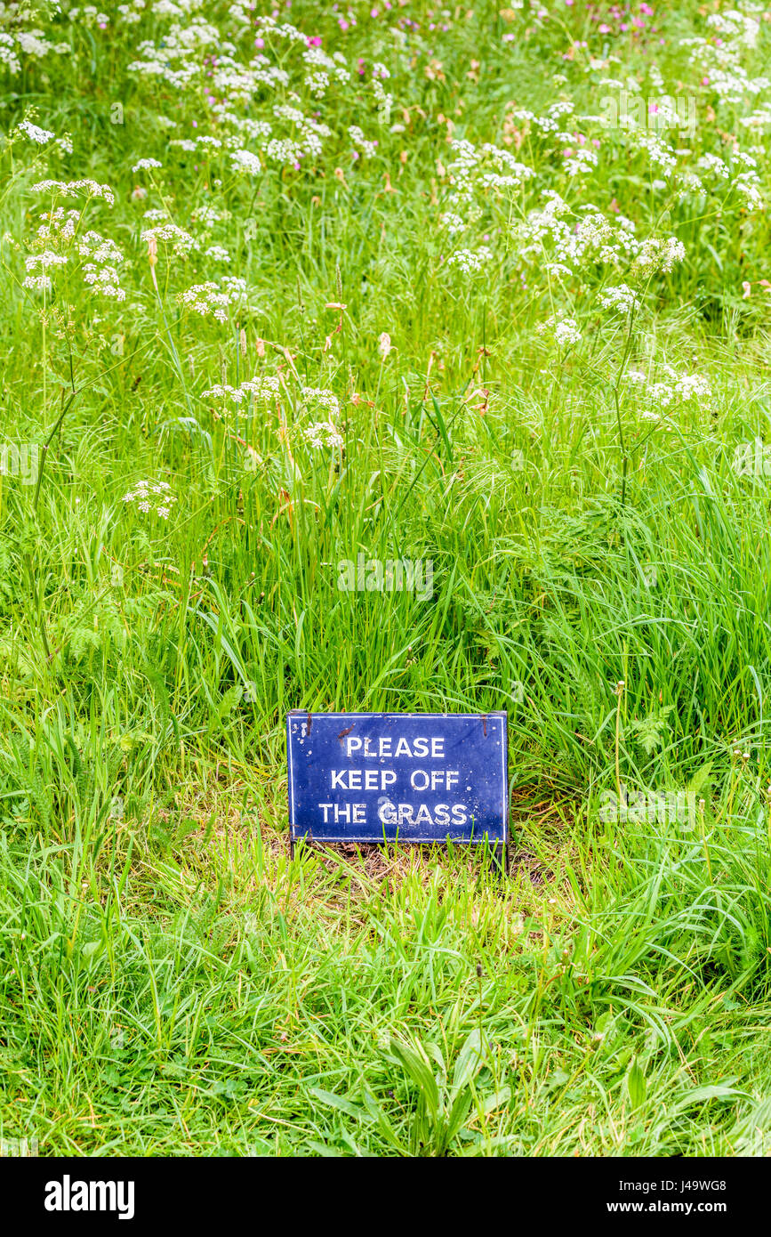 Please Keep Off The Grass Sign On The Wild Garden Of The Front