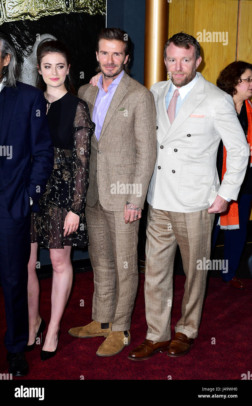 Millie Brady, David Beckham and Guy Ritchie arriving for the King