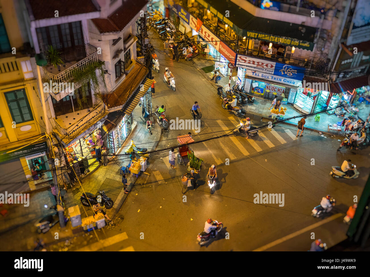 HANOI, VIETNAM CIRCA SEPTEMBER 2014 Busy corner street in the Hanoi