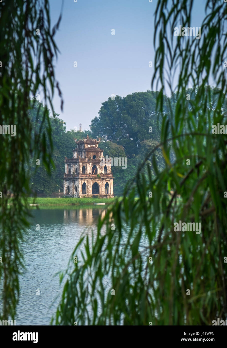 HANOI, VIETNAM - CIRCA SEPTEMBER 2014: View of the Turtle Tower, a famous landmark over the Hoan Kiem Lake, in Hanoi. Stock Photo