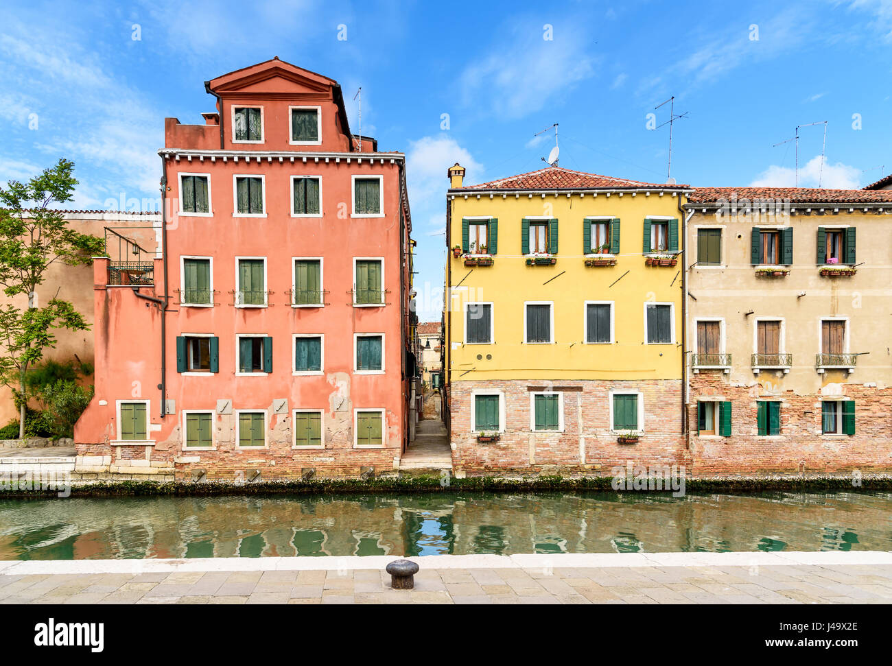 colorful houses on the canal and narrow street in Venice, italy Stock ...