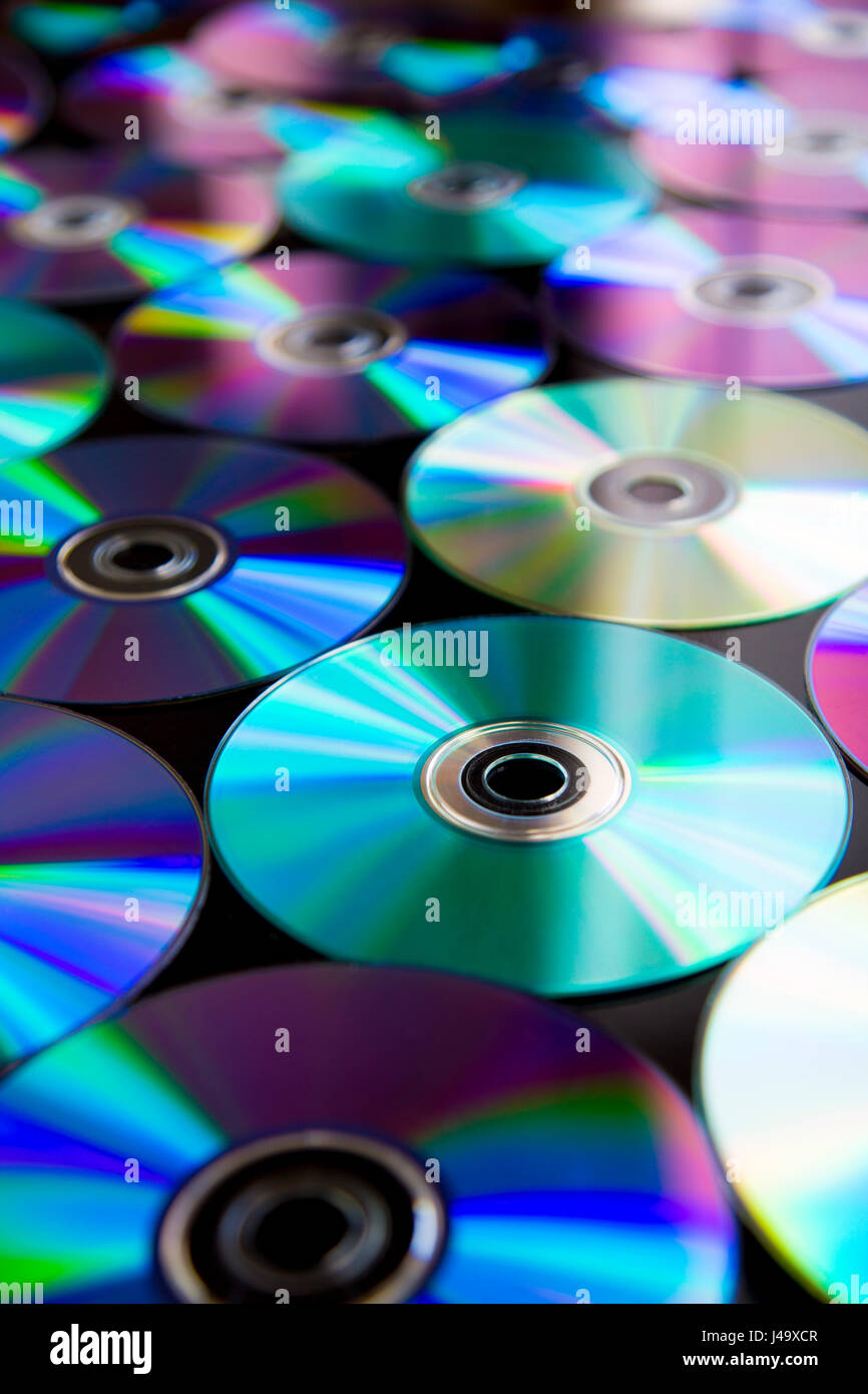 CDs / DVDs arranged in rows background Stock Photo
