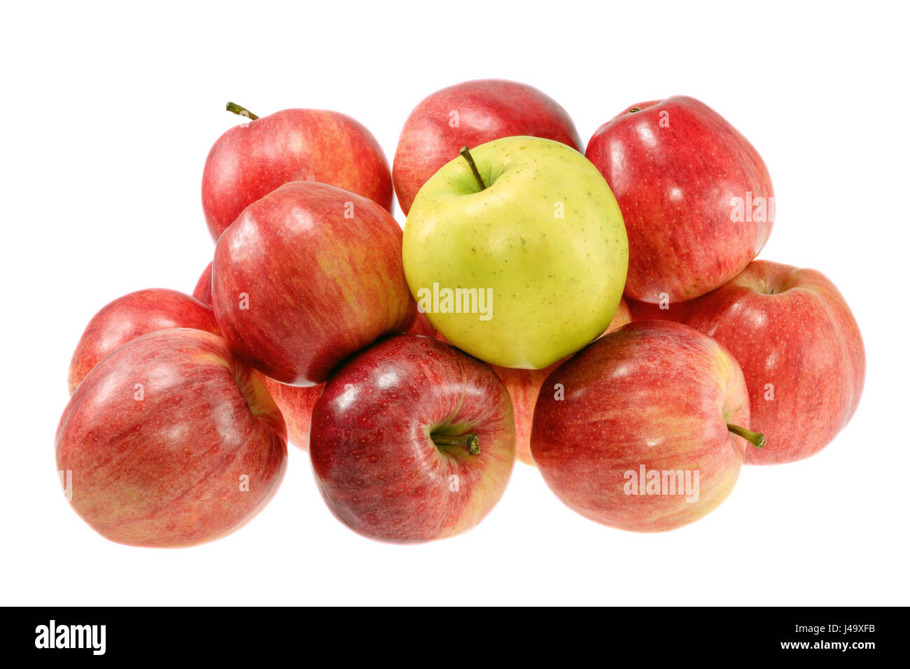 picture one ripe yellow apple with red apples Stock Photo Alamy