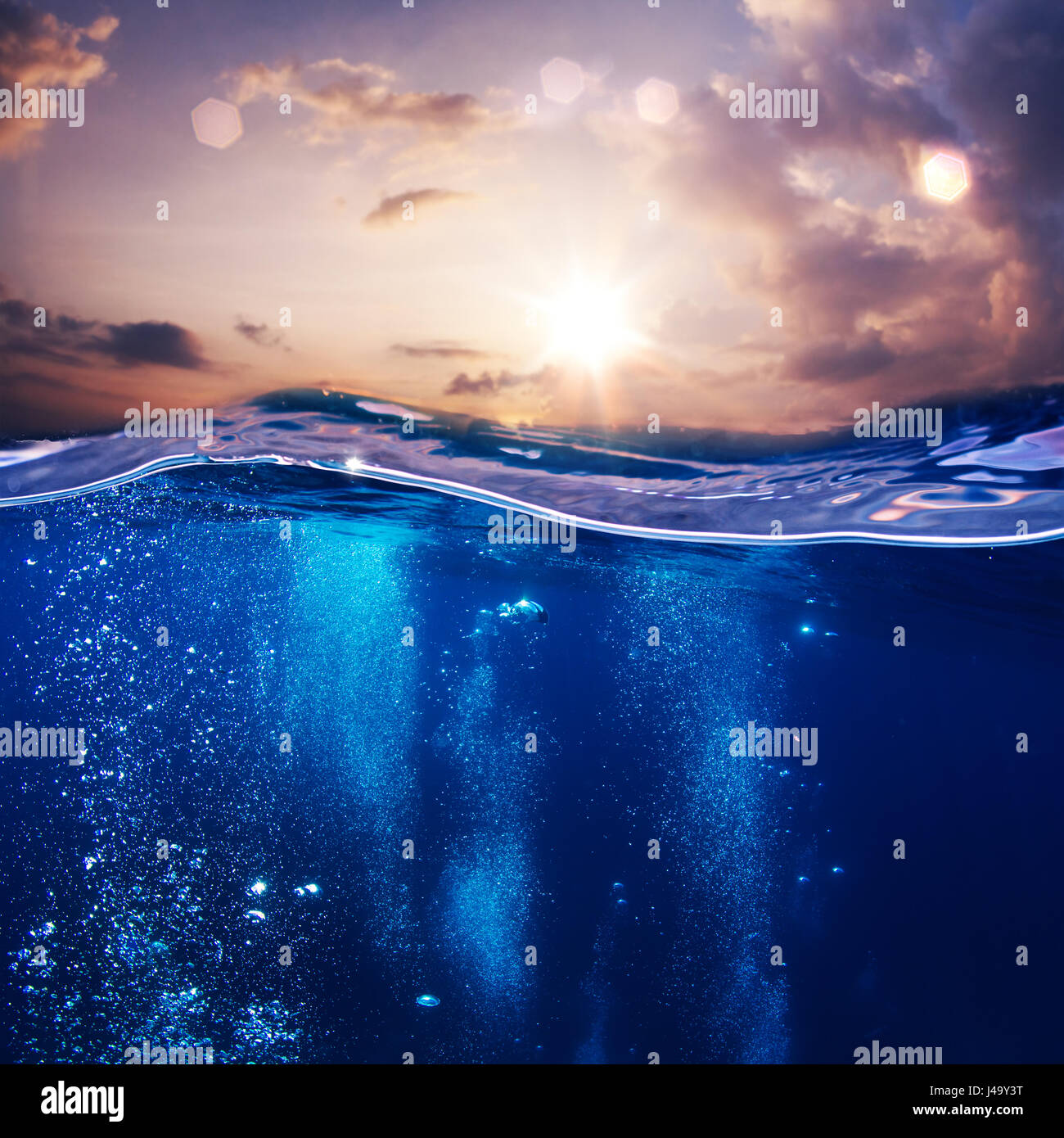 design template with underwater part and sunset skylight splitted by waterline Stock Photo