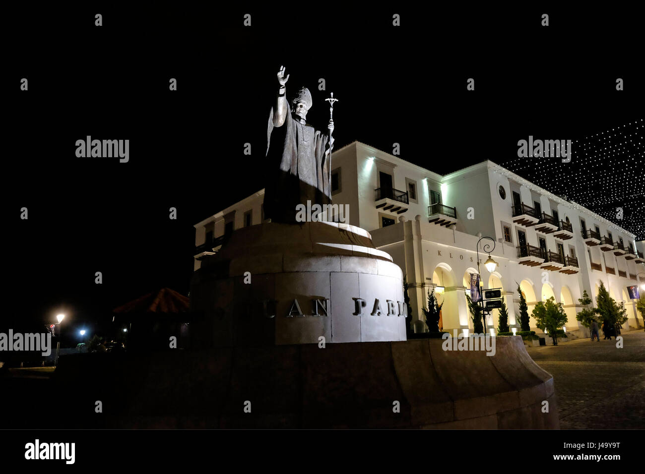 Monument to Pope John Paul II located in the white plaza of Paseo Cayala a new development of apartments, shops, nightclubs, boutiques and restaurants contained inside white walls at the edge of Guatemala city capital of Guatemala Stock Photo