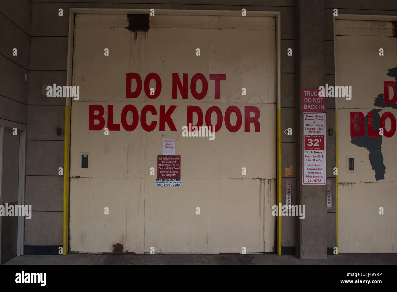 Garage door that reads do not block door in bold red letters. Stock Photo