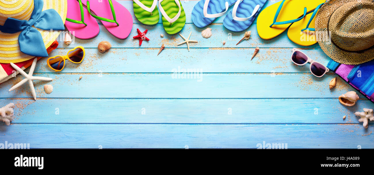 Four Pair Flip flops With Hats And Sunglasses On Wooden Deck Stock ...