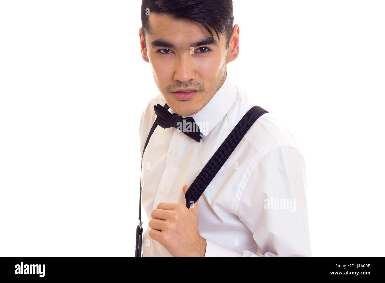 Young man with bow-tie and suspenders Stock Photo - Alamy