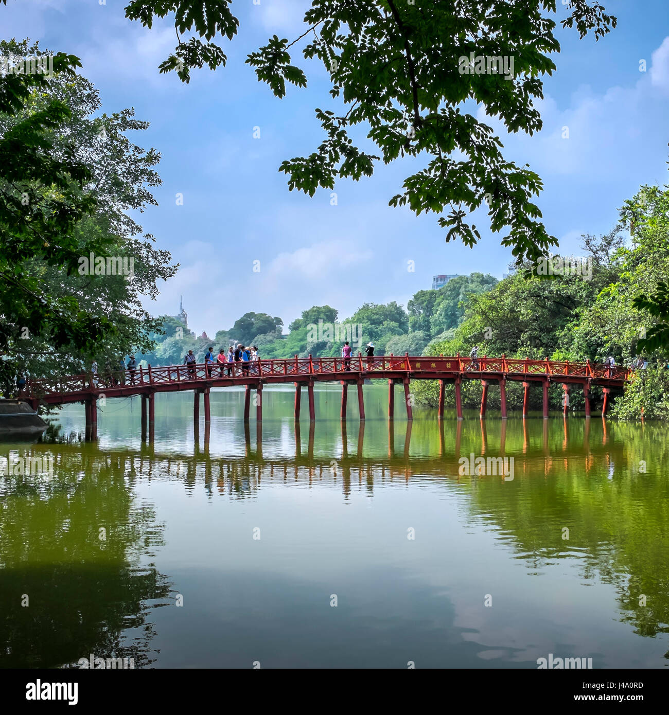 HANOI, VIETNAM - CIRCA SEPTEMBER 2014: View of the Huc Bridge, a famous landmark over the Hoan Kiem Lake, in Hanoi. Stock Photo