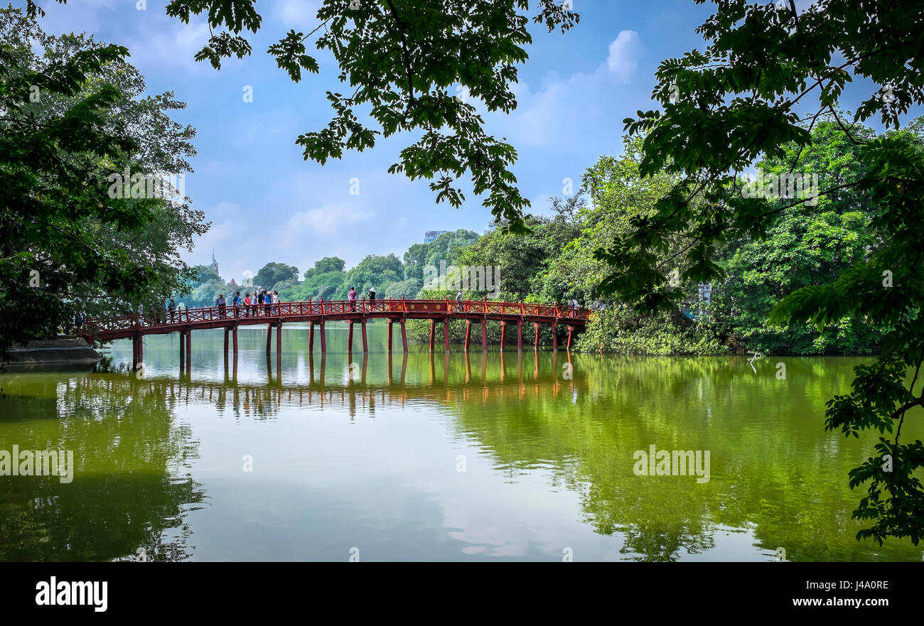 HANOI, VIETNAM - CIRCA SEPTEMBER 2014: View of the Huc Bridge, a famous landmark over the Hoan Kiem Lake, in Hanoi. Stock Photo