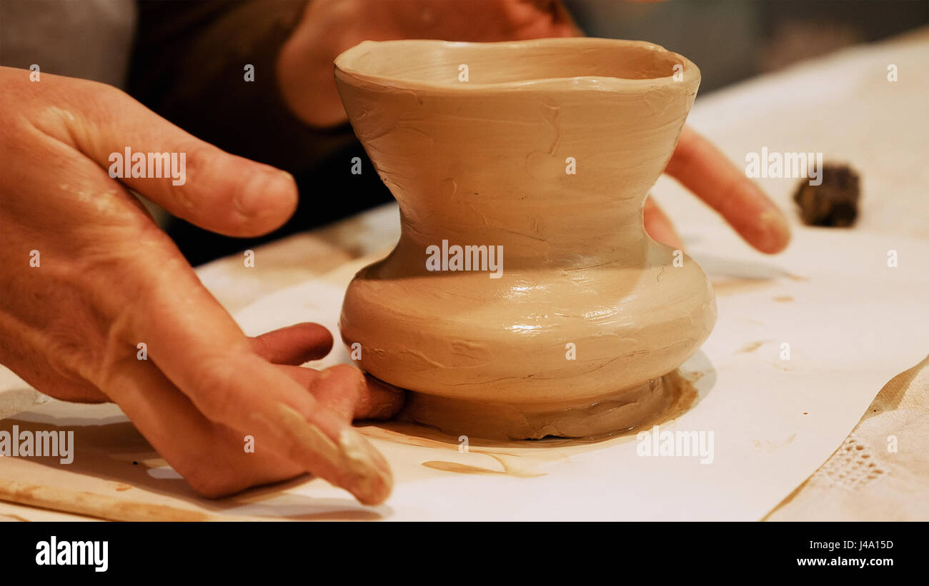Potter is making clay pot on the potter's wheel Stock Photo Alamy