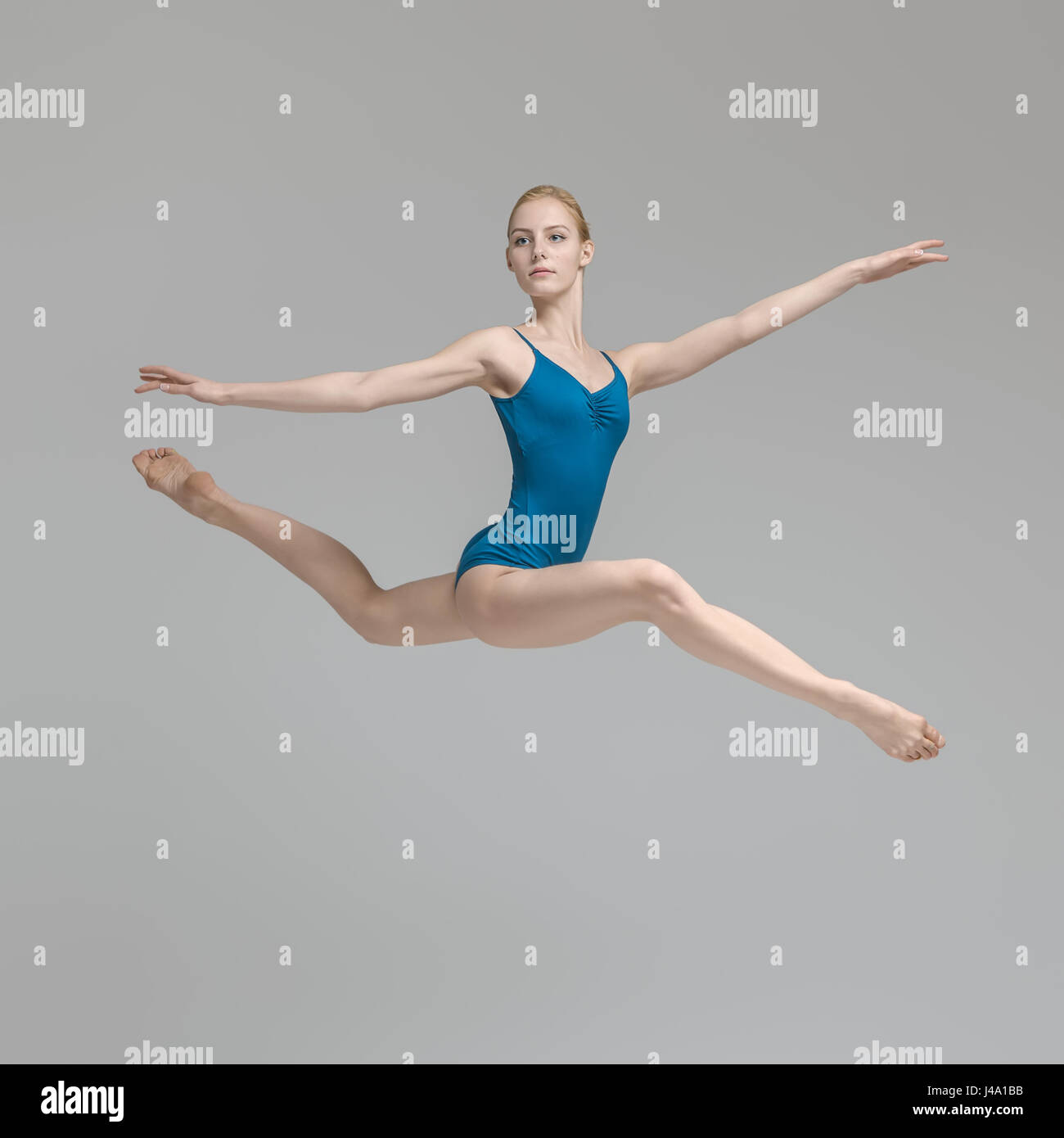 Ballerina posing in jump Stock Photo, Royalty Free Image: 140362191 - Alamy