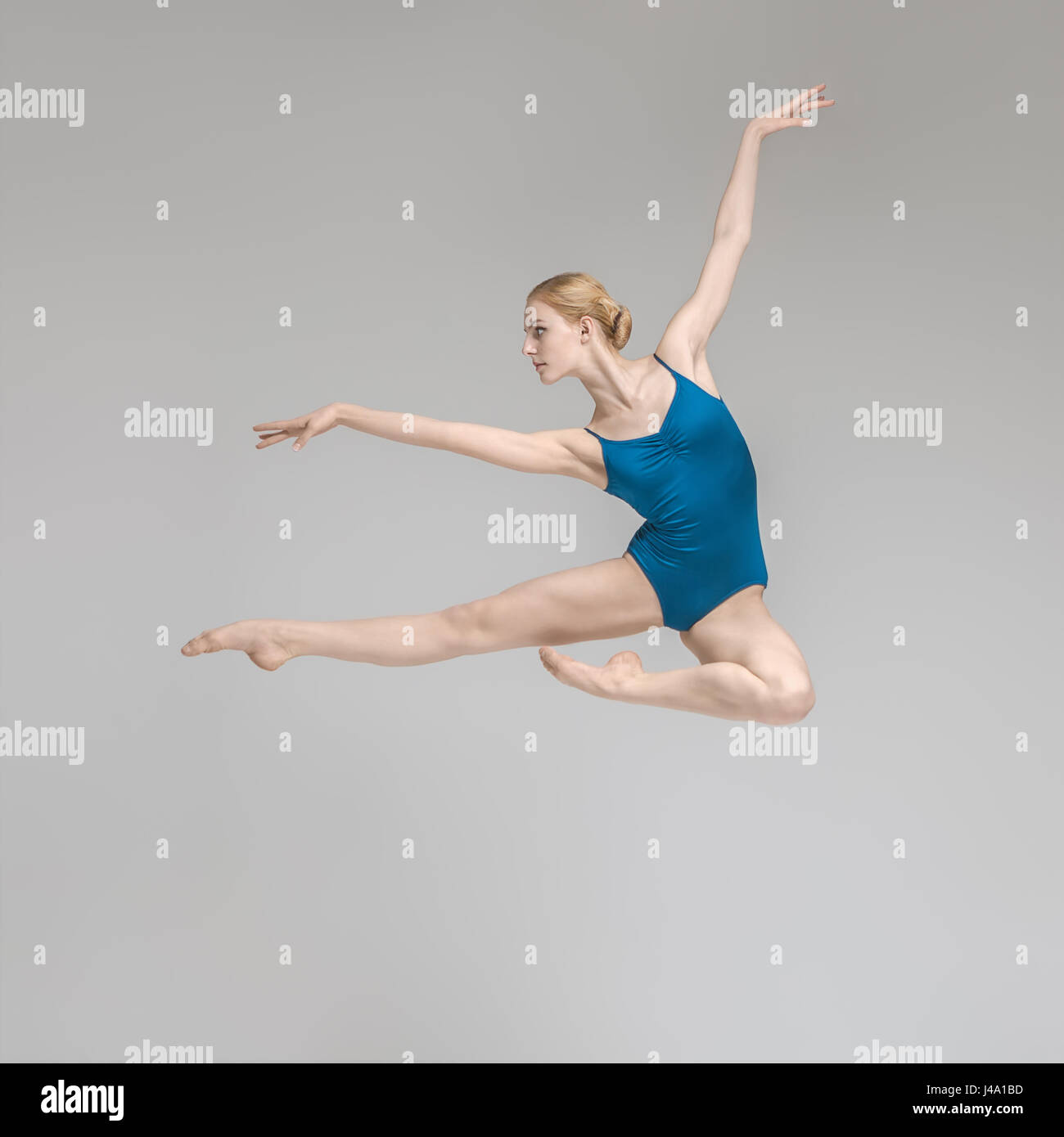 Ballerina posing in jump Stock Photo