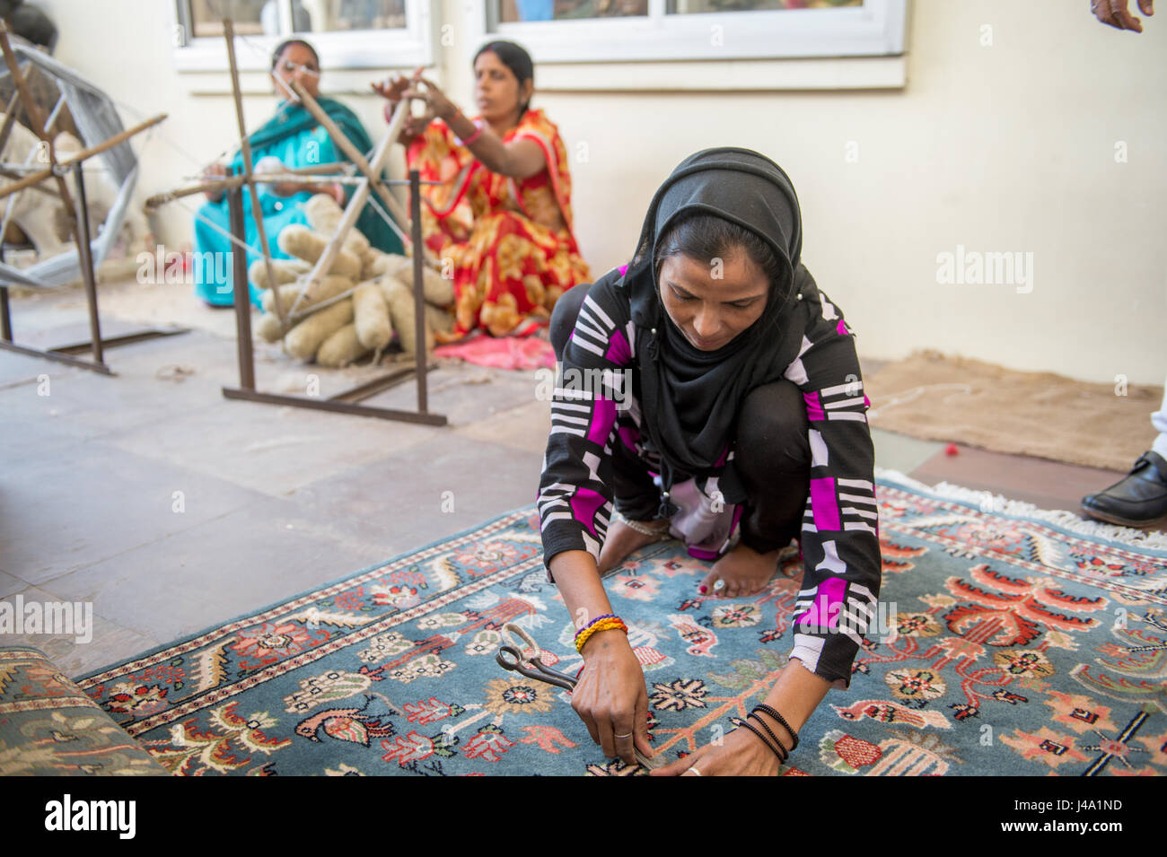 Jaipur, India - Indian women making oriental rugs Stock Photo